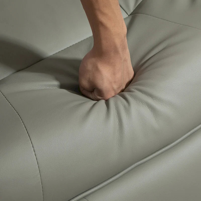 Sillón reclinable de cuero sintético con base giratoria y ajuste manual, con reposapiés cómodo y relajante